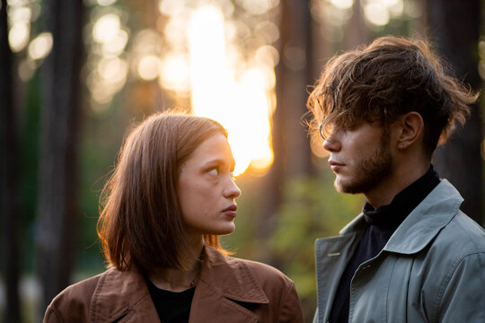 A loving couple hugging in the forest, a relationship crisis and separation