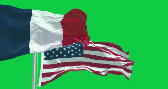 National flags of France and USA waving isolated on green background