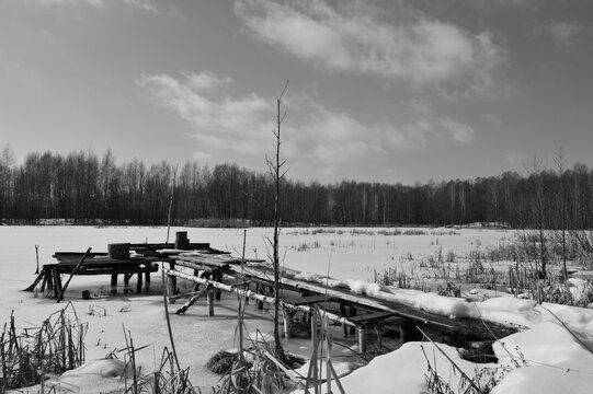 fishing boats uder ice in snow lake