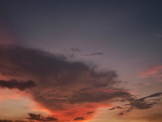 Fototapeta premium Beautiful dramatic sunset sky with orange and purple clouds. Perfect for nature and background theme