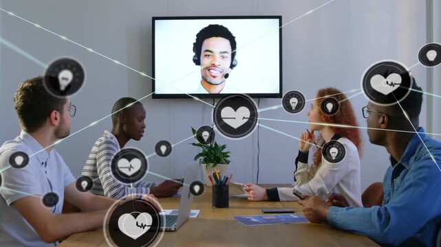 Animation of network of connections with icons over diverse colleagues having video call in office