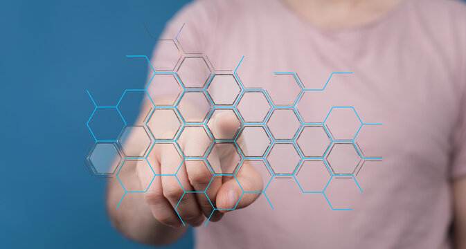 Person interacting with a digital interface, touching geometric network patterns. Concept of technology, connection, dat