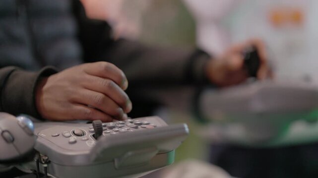 Disabled person using an adaptive joystick controller