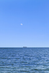 Sea and boat in blue sky background. Beautiful blue sky and clear sea. aqua, beautiful, beauty, blue ocean, blue sea, blue sky, boat, calm, coast, horizon, natural, ocean, blue, clean, india landscape
