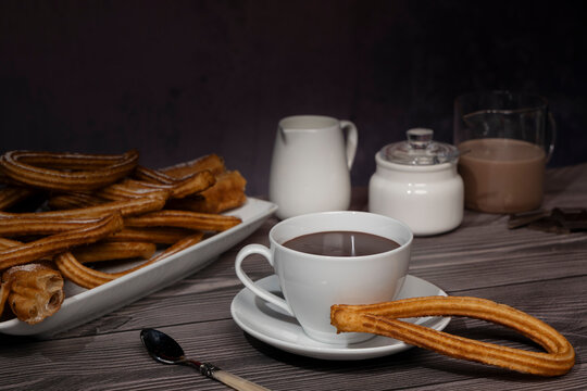 Traditional Spanish pastry churros with chocolate sauce