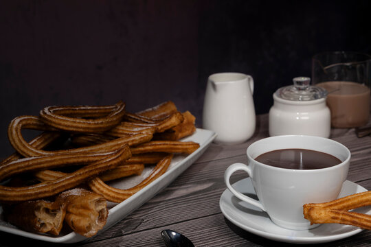 Cup of hot chocolate with traditional Spanish churros