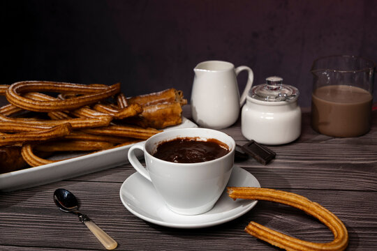 Churros and hot chocolate traditional Spanish breakfast still life