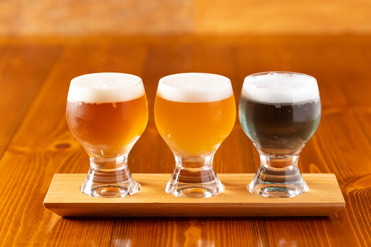 Refreshing craft beer and artisan drinks served at a luxury restaurant, romantic date night with premium beverages, sophisticated pub dining experience, high-end hospitality and social lifestyle.