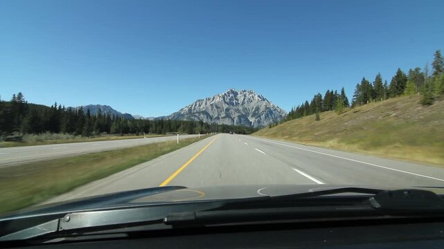 Driving towards a mountain on Trans Canada Hwy 1 in Alberta, Canada. HD.