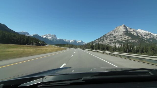 Driving through the mountains on Trans Canada Hwy 1 in Alberta, Canada. HD.