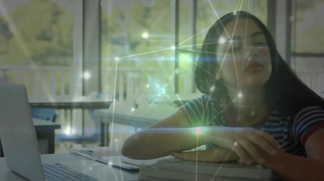 Animation of network of connections over schoolgirl sleeping on desk