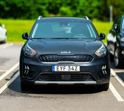Gothenburg, Sweden - June 01 2024: 2022 Kia Niro black compact SUV parked in sunny lot.