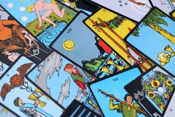 Tarot cards spread on a wooden table for divination and fortune telling