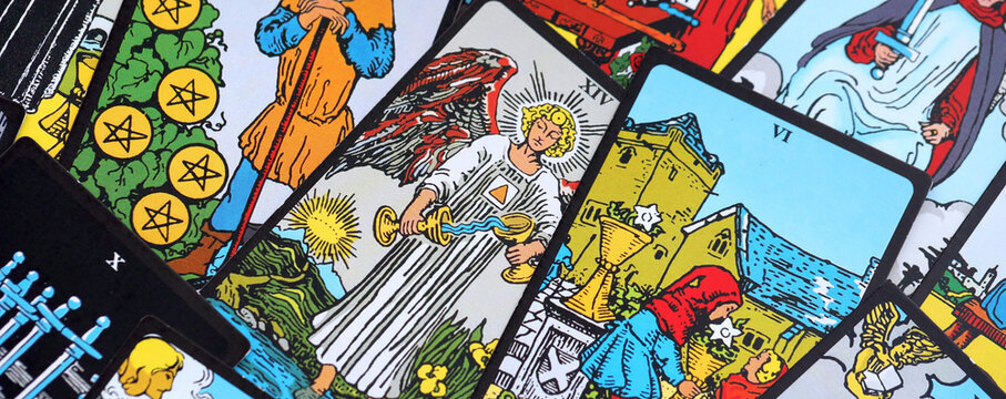 Big pile of different classical tarot cards on table. Pattern of tarot cards with traditional standard meanings