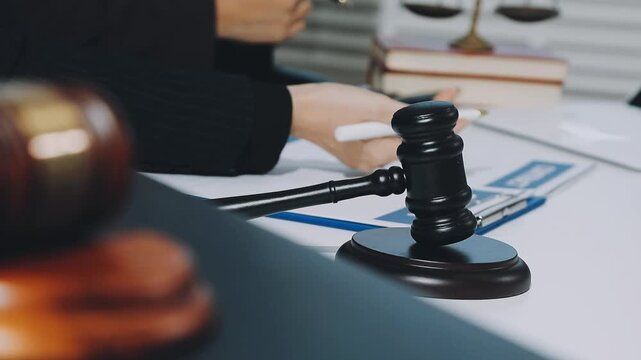Law theme, mallet of the judge, law enforcement officers, evidence-based cases and documents taken into account.