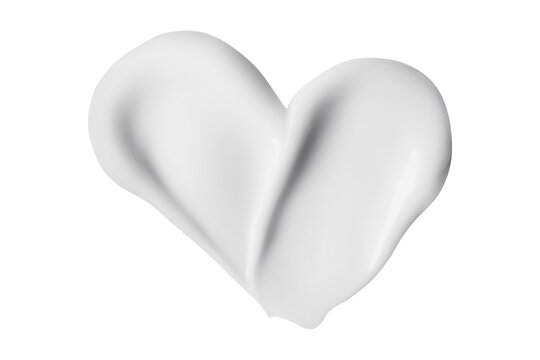 White cosmetic cream sample swirled into heart shape representing skin care and beauty
