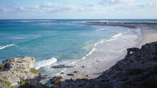 4k 60p footage of dramatic coastal view to Struis Point (Struispunt) and Saxon Reef from rugged sea cliffs near Waenhuiskrans Cave, Arniston. Turquoise Overberg waters, Western Cape, South Africa.