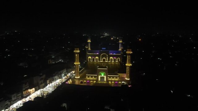 Glowing Sadiq Mosque at Night
Drone Footage During Ramadan Celebration - Wide angle drone shot - 4k video