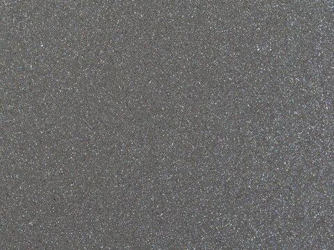 Macro shot of fine silver metallic car paint texture