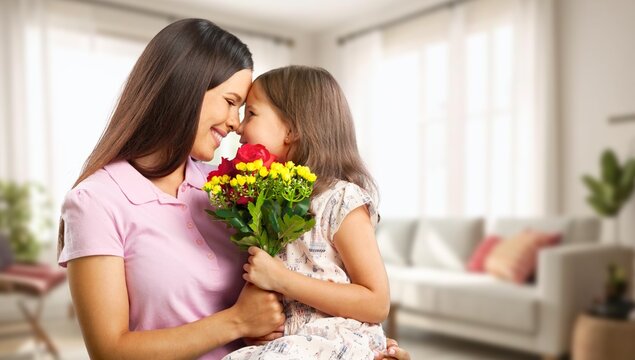 Mother and daughter with a fresh bouquet of flowers
