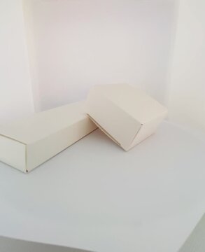 Minimalist White Cardboard Boxes Rotating on White Background - 360 Product Mockup