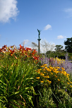 Ivar Huitfeldt Column Monument in Copenhagen Denmark Surrounded by Summer Flowers