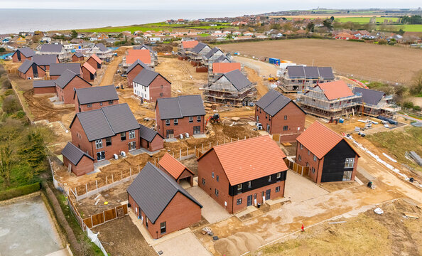 Aerial view of a new housing estate being built near the coast in North Norfolk, UK