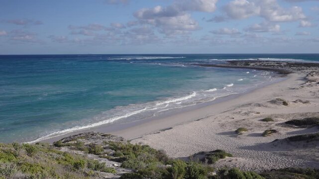 4k 60p footage of dramatic coastal view to Struis Point (Struispunt) and Saxon Reef from rugged sea cliffs near Waenhuiskrans Cave, Arniston. Turquoise Overberg waters, Western Cape, South Africa.