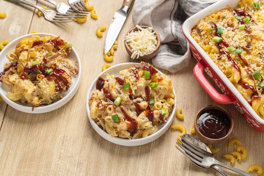 Barbecue pulled pork mac and cheese with bbq sauce drizzle. Cheesy food