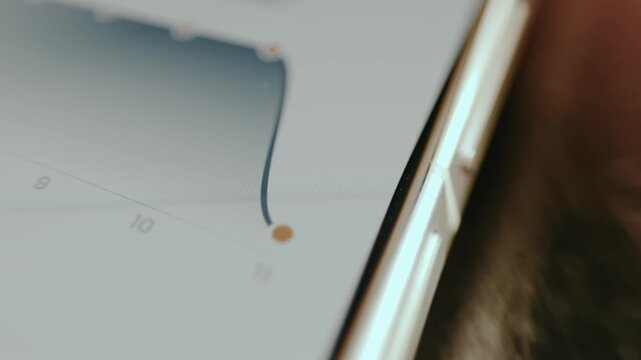 Linear graph with a downward trend on a mobile phone screen