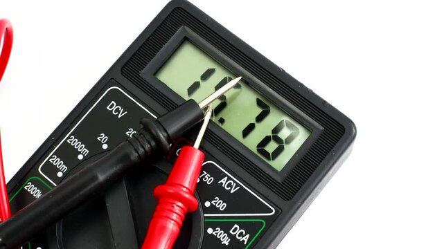 Close-up of a multimeter on a clear surface, highlighting precision and versatility for electrical measurements.