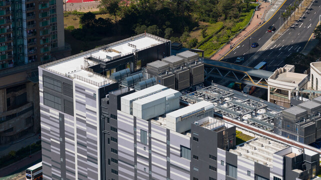 Aerial view of the imposing Data Center, a modern structure juxtaposed against the natural greenery, Tseung Kwan O, New Territories, Hong Kong.