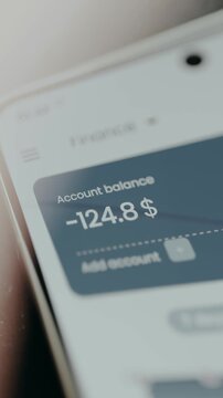 Mobile banking application interface showing a negative account balance