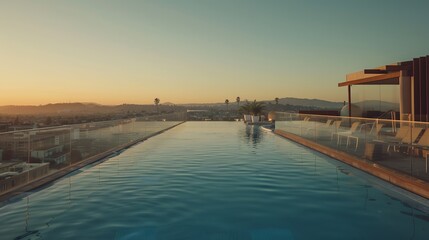 Fototapeta premium Luxurious rooftop infinity pool with panoramic city views at golden hour sunset