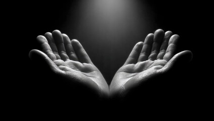 Fototapeta premium Open Hands Reaching Upwards in Dramatic Spotlight.