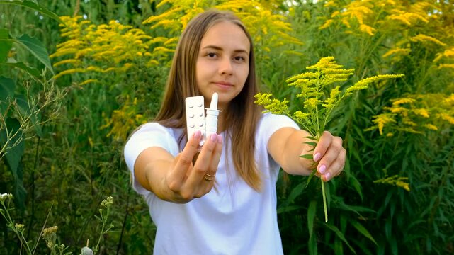 A woman is allergic to ragweed. Selective focus.