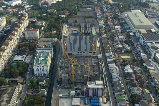 Aerial view of aerial view of a large data center construction site with multiple tower cranes developing crucial digital infrastructure in bangkok, Thailand