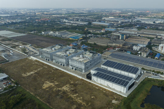 aerial view of a modern data center complex featuring server buildings and solar panels, reflecting high tech infrastructure and sustainable energy in bang sao thong, thailand