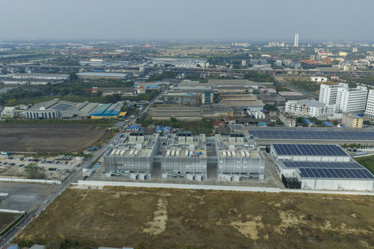 aerial view of data center complexes featuring solar pv panels, supporting cloud technology and ai infrastructure in bang sao thong