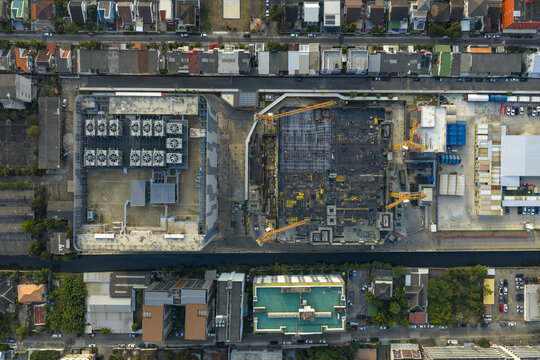 Aerial view of modern ai data processing center construction site and completed facility with cooling units, aerial view in bang kapi, bangkok, thailand