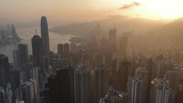Cinematic aerial video of Hong Kong at sunrise morning golden hour