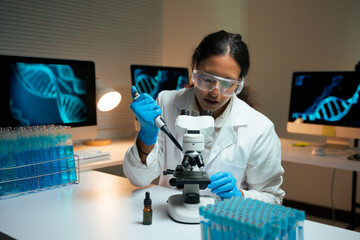 Female scientist doing genetic research in laboratory © Parichat