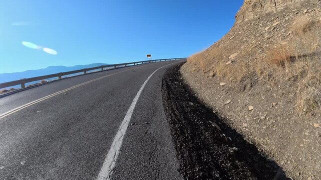 Immersive POV from winter biking on the Centennial Road along Horsetooth Reservoir in Colorado foothills near Fort Collins