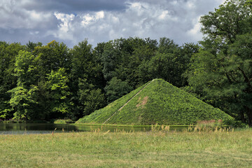 Land Pyramid and Snake Lake Bridge in Branitzer Park, historic English landscape garden in Cottbus, Brandenburg, Germany

