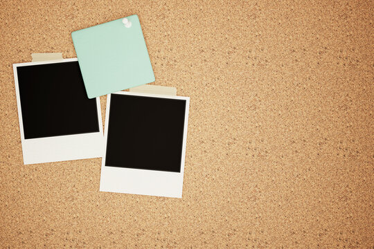 Blank Polaroid Frames and Mint Green Sticky Note Pinned on Cork Board