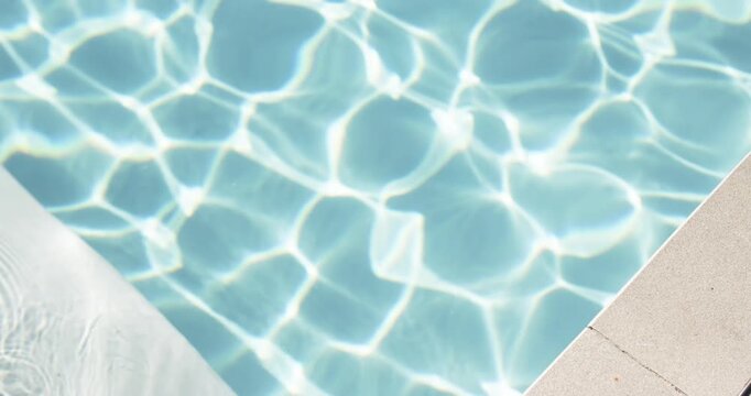 Pool corner showing pale blue water shimmering with bright caustics and white cushion floating