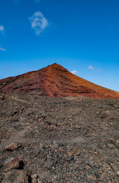 Lanzarote, Canary Islands: breathtaking desert landscape and red mountain in Timanfaya National Park (Parque Nacional de Timanfaya), famous geological park entirely made up of volcanic soi