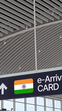 airport directional sign indicating India digital e-Arrival Card lane and Fast Track Immigration for the Trusted Traveller Program or FTI TTP - program for trusted travellers, representing modern