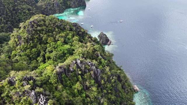 Cinematic aerial video of tropical islands of Coron in the Philippines with limestone cliffs and azure blue water lagoonsc