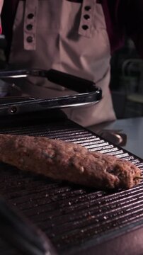 Juicy sausages grilled on the grill.